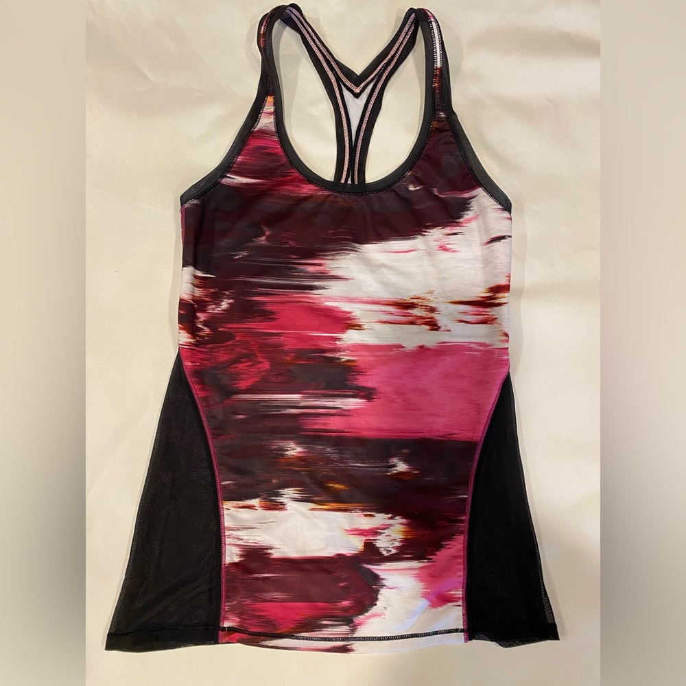 Lululemon racer back tank top with see through mesh on the back.  Size 6